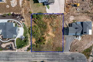 Aerial view of property and surrounding area with property parcel outlined
