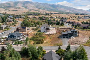 View of property location featuring nearby suburban area and mountains