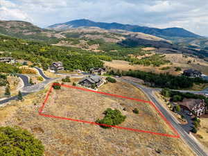 View of property location with a mountain backdrop and property parcel outlined