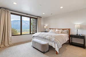 Bedroom featuring carpet, recessed lighting, and a mountain view