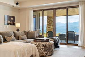 Living area with a mountain view and wood finished floors