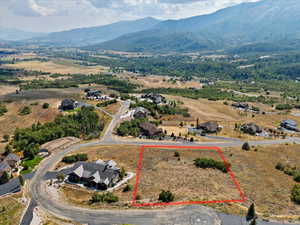 Aerial overview of property's location featuring mountains and property boundaries highlighted