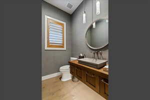 Bathroom with vanity and light wood finished floors