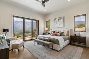 Bedroom with access to exterior, light wood-style flooring, a ceiling fan, recessed lighting, and a mountain view