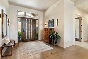 Foyer entrance featuring hardwood / wood-style floors