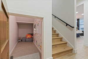 Stairway featuring baseboards and recessed lighting