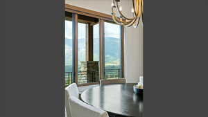 Dining area featuring a mountain view and a chandelier