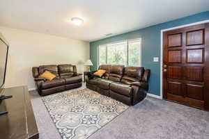 Living room with carpet floors