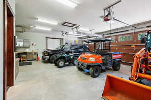 Garage featuring a garage door opener