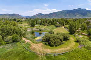 Aerial view of sparsely populated area with a water and mountain view