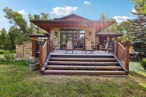 Wooden terrace with a yard