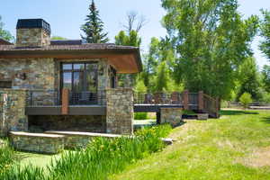 View of yard with a wooden deck