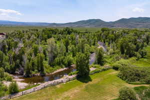 Overview of rural landscape with a water and mountain view