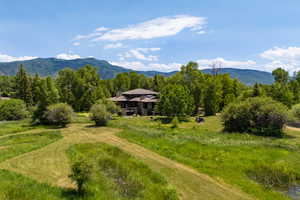 Mountain view featuring a forest and rural landscape