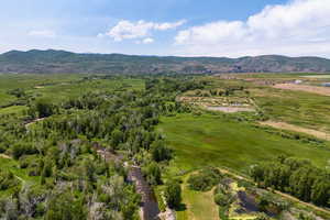 Aerial view of sparsely populated area featuring a mountainous background