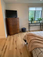 Bedroom featuring light wood finished floors and recessed lighting