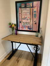 Detailed view of wood finished floors and baseboards