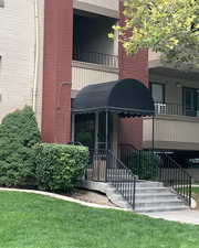 View of property with stairs