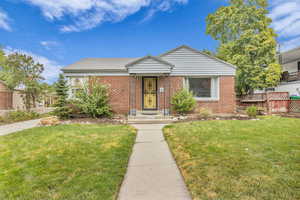 View of front of property featuring brick siding