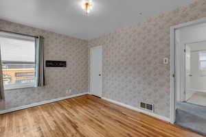 Empty room with light wood-style floors