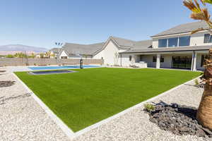 Fenced backyard with a patio area
