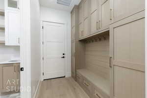 Mudroom featuring light wood-style flooring