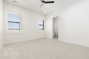 Unfurnished bedroom with carpet flooring, recessed lighting, ceiling fan, and ensuite bathroom