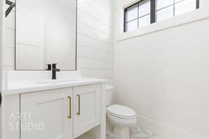 Bathroom featuring vanity and toilet