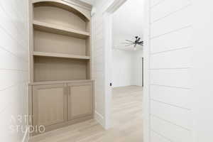 Corridor with light wood-style floors