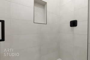 Bathroom view of a tile shower