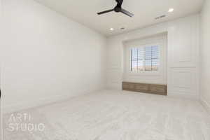 Empty room featuring light colored carpet, ceiling fan, and recessed lighting