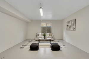 Sitting room with finished concrete floors