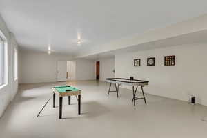 Game room featuring finished concrete floors