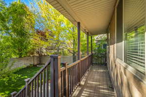 Porch with a fenced backyard