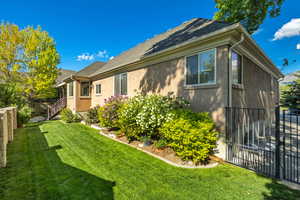 View of side of property featuring stucco siding