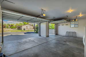Garage with a mountain view and a garage door opener
