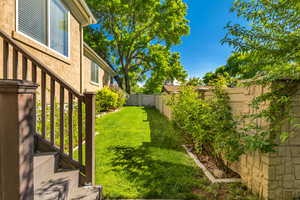 View of fenced backyard