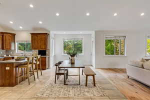 Dining space with recessed lighting and light tile patterned flooring