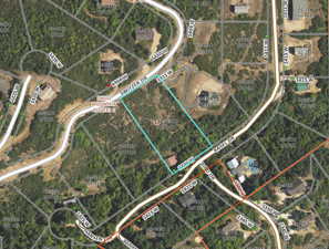 Aerial overview of property's location featuring property boundaries highlighted