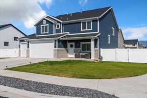 View of front of property featuring a gate, concrete driveway, a porch, board and batten siding, and an attached garage