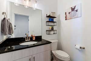 Bathroom with vanity and toilet