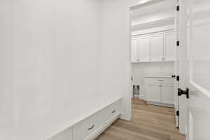 Mudroom with light wood-style flooring