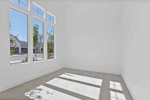 Spare room featuring carpet flooring