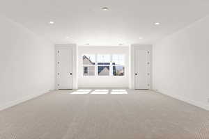 Unfurnished room featuring carpet and recessed lighting
