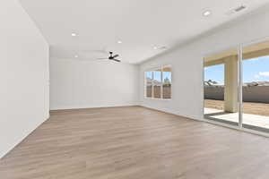 Spare room featuring light wood-type flooring, recessed lighting, and a ceiling fan