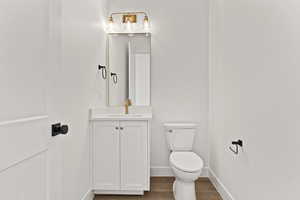 Bathroom with vanity and dark wood-style floors
