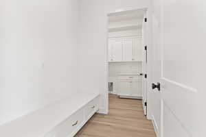 Mudroom with light wood-type flooring