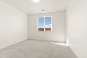 Unfurnished room with carpet and baseboards