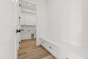 Mudroom with light wood-style floors