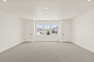 Unfurnished room featuring carpet flooring and recessed lighting